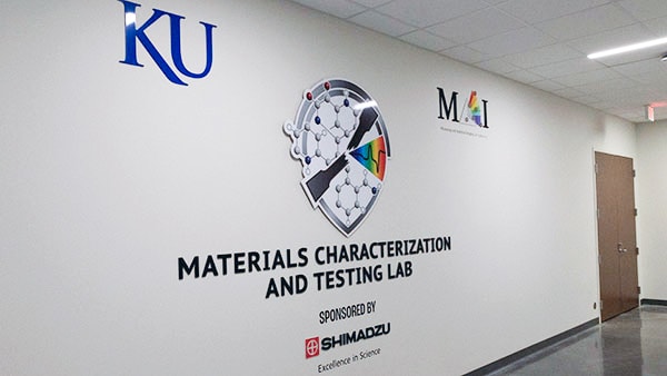Steve Soper (left) along with Vice Chancellor for Research Shelley Hooks (second from right) and Shimadzu executives at the ribbon cutting for KU's new Materials Characterization & Testing Lab